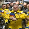 Russian cosmonauts arrive at International Space Station dressed in yellow and blue of Ukraine